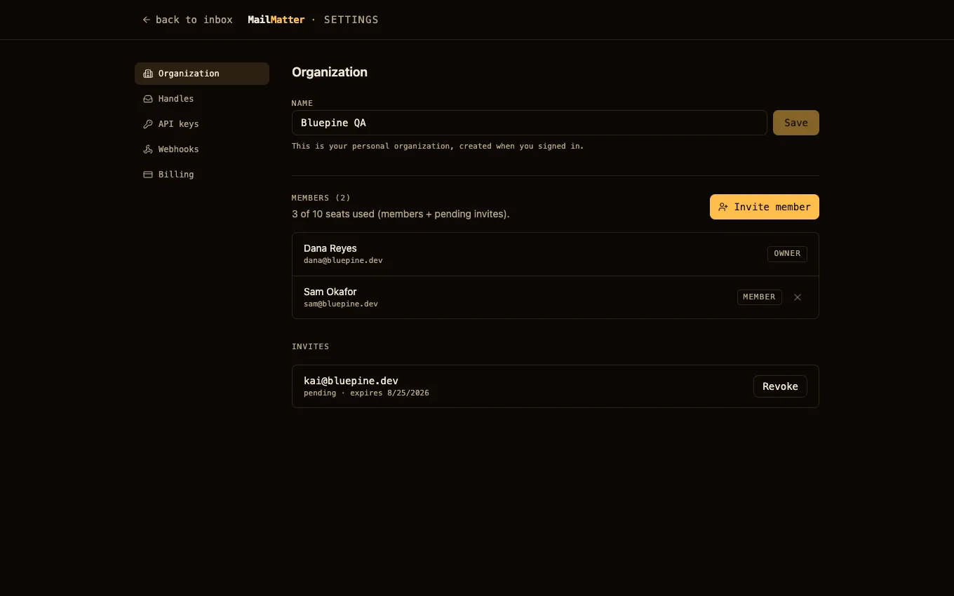 Settings → Organization: members with roles, seat count, and a pending invite with its revoke action